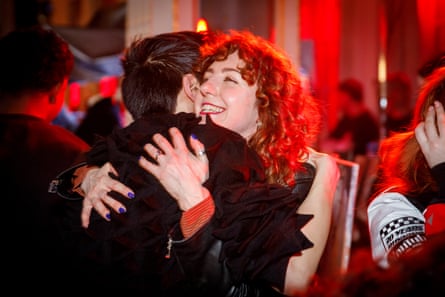 Brand strategist Vix Seffens hugs Chet Lo at the show.
