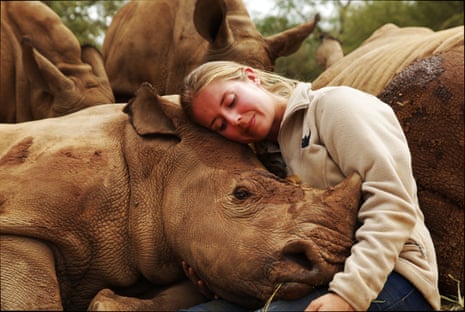 Wild Animal Reunions … Jade Aldridge with an orphaned rhino in Hoedspruit, South Africa.