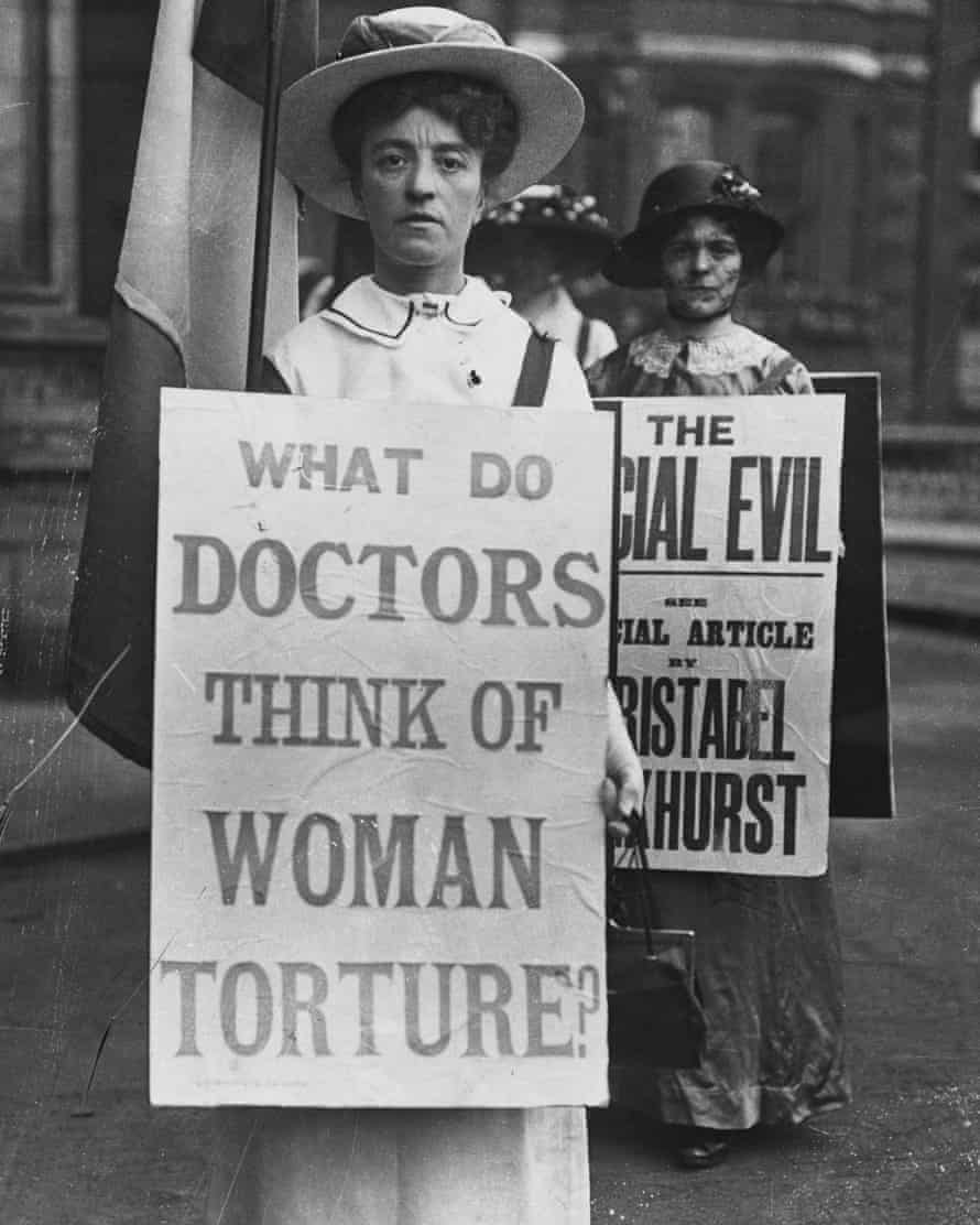 A woman protests outside the Royal Albert Hall, which is hosting the International Congress of Medicine.