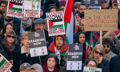 People take part in a Scottish Palestine Solidarity Campaign demonstration in Glasgow.