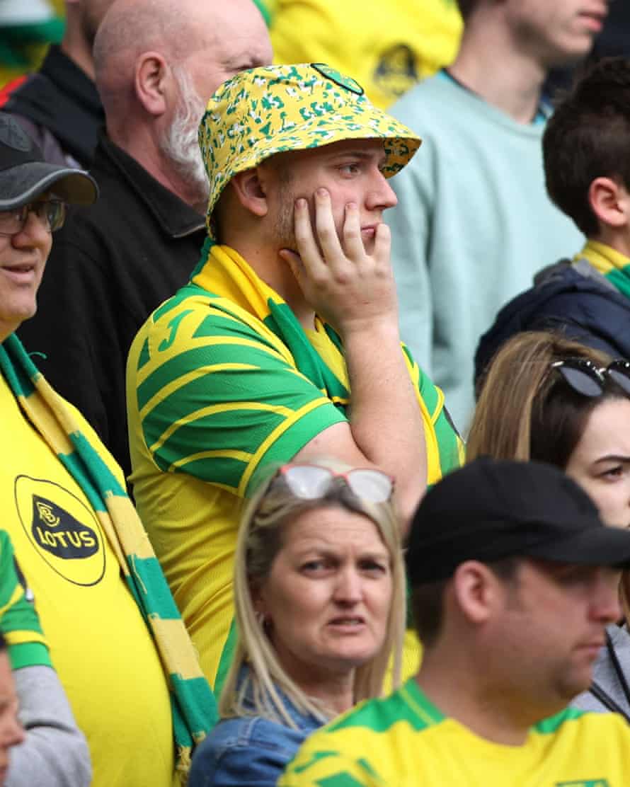 A Norwich City fan looks dejected after his side were relegated from the Premier League after defeat to Aston Villa.