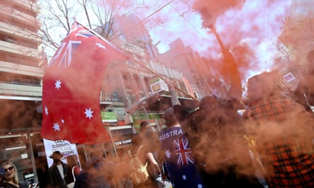 Protesters set off flares in Melbourne.