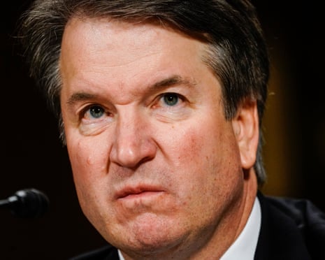 Kavanaugh scowling.