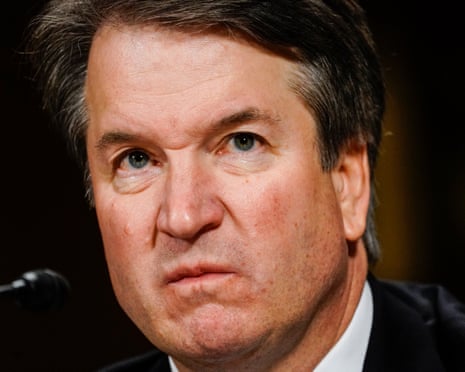 Kavanaugh scowling.