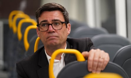 Burnham seated on a Bee network bus in Manchester
