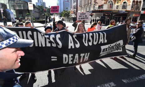 Extinction Rebellion protesters blocking traffic in Brisbane, 15 July 2019.