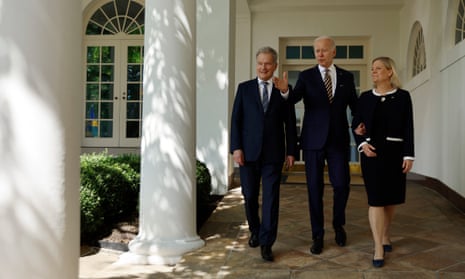 US president, Joe Biden (C)m walks with Finland’s president, Sauli Niinistö (L), and Sweden’s prime minister, Magdalena Andersson, at the White House.