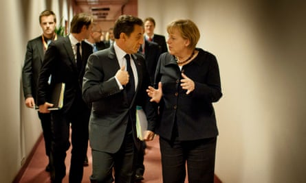 Merkel speaking with the then French president, Nicolas Sarkozy, at the EU headquarters in Brussels on 22 October 2011.