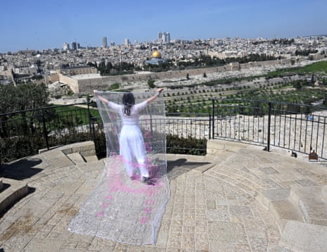Petr Macakova, a Christian from the Czech Republic, prays for peace on the Mount of Olives overlooking the Dome of the Rock in the Al-Aqsa Mosque compound on the third Friday of the Muslim holy month of Ramadan, in East Jerusalem on Friday, March 6, 2026.