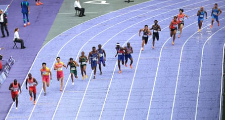 Christian Coleman struggles to hand the baton to teammate Kenneth Bednarek (centre).