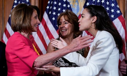 Pelosi greets Ocasio-Cortez before her ceremonial swearing-in picture, in January 2019.
