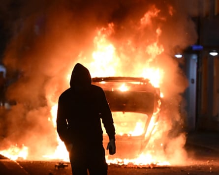 A vehicle burns during a protest in Ballymena, Northern Ireland.