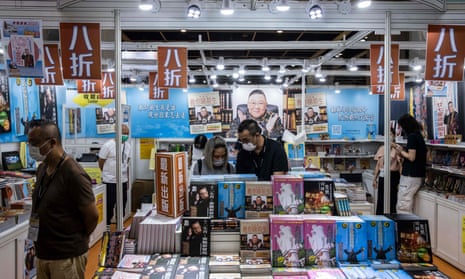 People browse a stall at the annual book fair in Hong Kong. Some publishers say they have been banned for political reasons