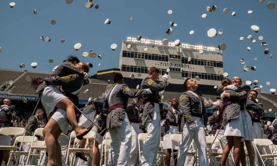 Graduating cadets toss their hats in the air at the US military academy at West Point, New York on Saturday.