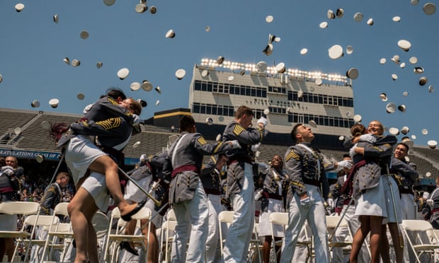 Graduating cadets toss their hats in the air at the US military academy at West Point, New York on Saturday.