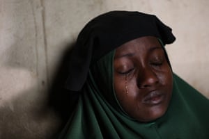 Humaira Mustapha, whose two daughters were kidnapped by gunmen at the government girls secondary school, cries at her home