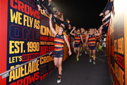 Captain Jordan Dawson leads Adelaide from the field