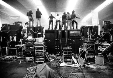 Ravers dance on sound equipment