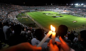 Supporters of Atlético Nacional pay tribute to the 71 people who died in the Colombian plane crash, including members of the next opponents, the Brazilian club Chapecoense