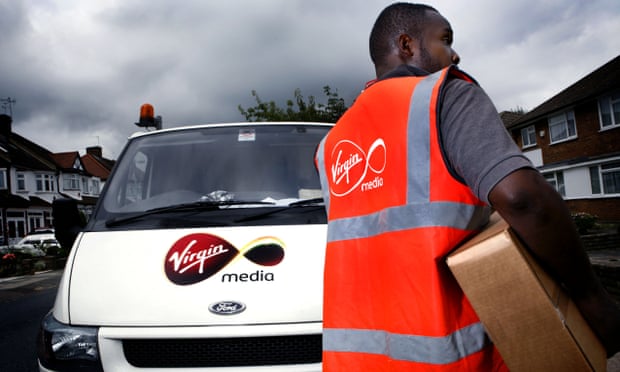 Virgin Media engineers connecting a house to the broadband network in north London