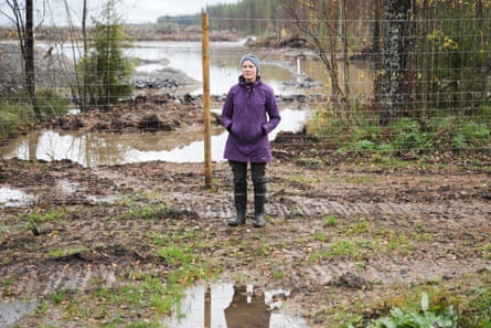 Hanna Halmeenpää stands by a fence near the muddy site of GoogleâÂÂs planned Finland data centre.