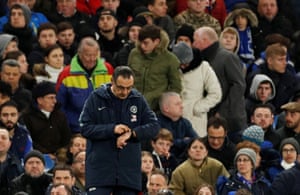 Maurizio Sarri checks his watch.