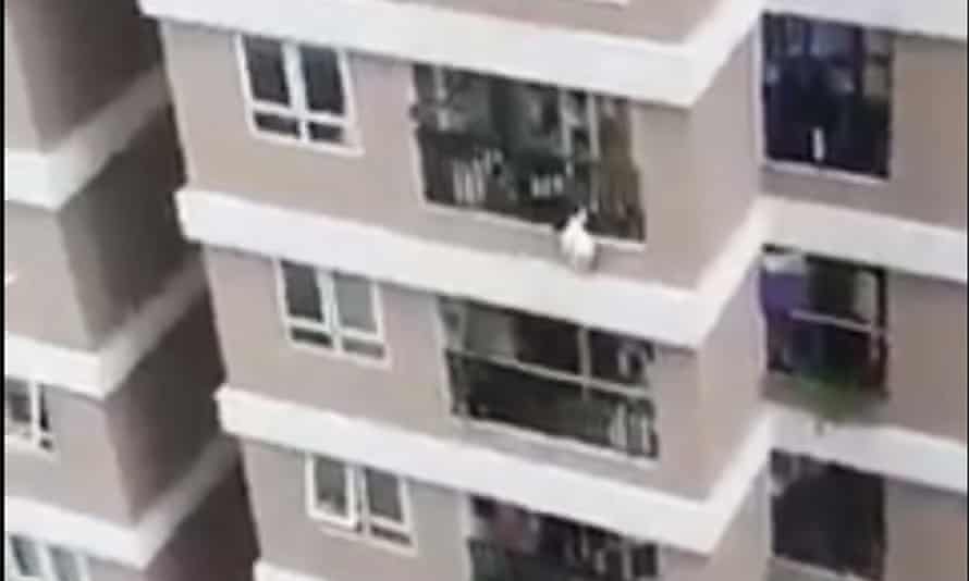 A two-year-old Vietnamese girl falling from 12th floor. A delivery man caught her after seeing her hanging from the outside of the building.