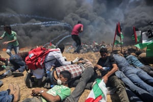 Palestinians set tyres on fire to disrupt Israeli forces in during the protests on Monday