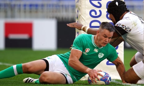 Ireland's Johnny Sexton goes over for their fifth try against Romania.