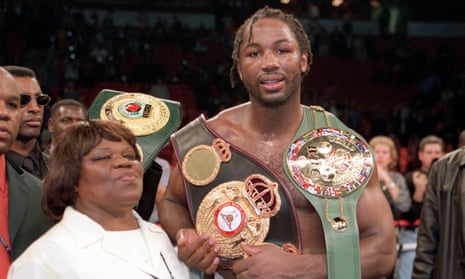Lennox Lewis poses with his mother, Violet Blake, after defeating Evander Holyfield to unify the undisputed world heavyweight championship on 13 November 1999.