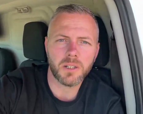 Robert Kenyon sits in the driver's seat of a vehicle, looking at the camera