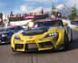 Forza Horizon 6.'s animated racing cars compete on a track with spectators, a Horizon Festival banner, and a snow-capped mountain backdrop