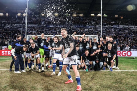 Arminia Bielefeld players celebrate their stunning upset against Bayer Leverkusen in their semi-final