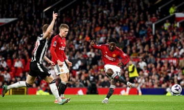 Kobbie Mainoo of Manchester United scores his team's first goal during the Premier League match against Newcastle United.