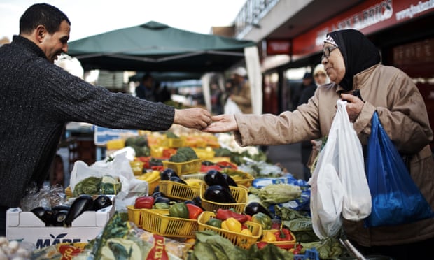 A woman shops at a London street market