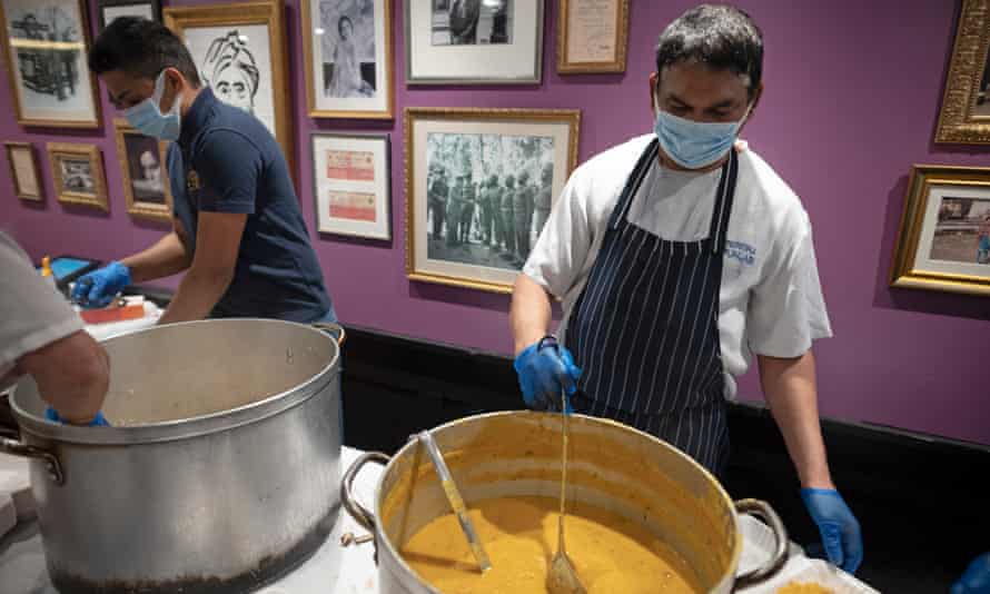 Food is cooked at the Punjab restaurant, Covent Garden, for homeless people in London.
