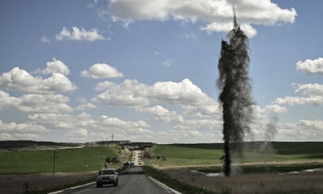 A mortar explodes next to the road leading to the city of Lysychansk in the eastern Ukranian region of Donbas.