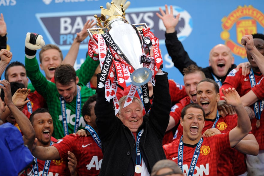 Sir Alex Ferguson lifts the Premier League trophy in 2013