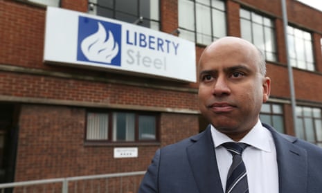 Sanjeev Gupta in a suit and tie standing outside a building with a sign on it saying Liberty Steel.