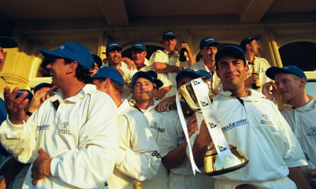 Adam Hollioake, holding the county championship trophy, was a serial winner at Surrey alongside Graham Thorpe.