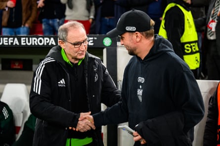 Celtic’s Martin O’Neill (left) and the Stuttgart manager, Sebastian Hoeness, shake hands before their Europa League encounter