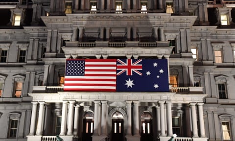An Australian flag is seen with a US flag on the Eisenhower Building for Australian prime minister Scott Morrison’s state visit to Washington DC in September 2019. America’s response to the coronavirus pandemic has exposed the worst elements of the Trump administration. 