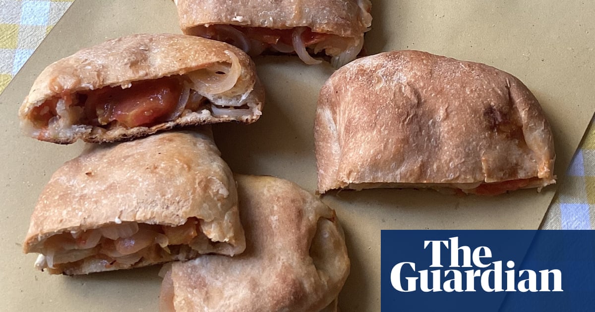 Rachel Roddy's recipe for folded flatbreads with tomato, onion and cheese (scacce) | A kitchen in Rome