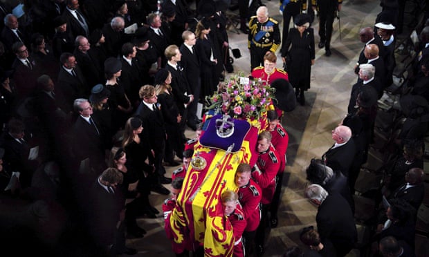 King Charles III and the Queen Consort follow the coffin into St George's Chapel, at Windsor Castle.