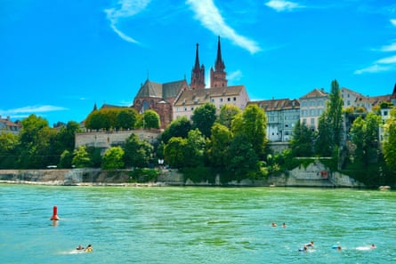 Swimmers in the Rhine beside Basel Cathedral