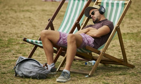 A man rests in a deck chair in London’s Green Park 