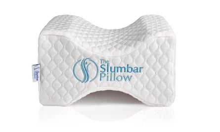 A white quilted Slumber Pillow with blue embroidered logo