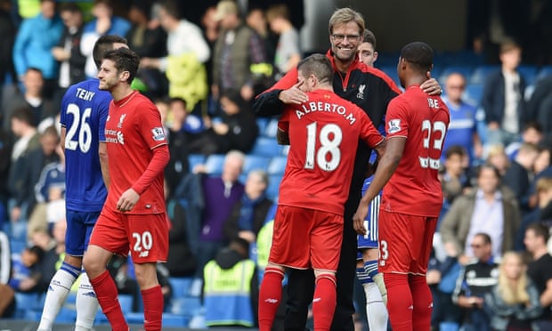 Jürgen Klopp embraces Alberto Moreno and Jordon Ibe