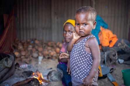 Faisa Ali, 12, prepares food in her makeshift home in the Xidig IDP camp in Mogadishu.