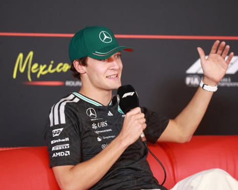 George Russell talks at a press conference